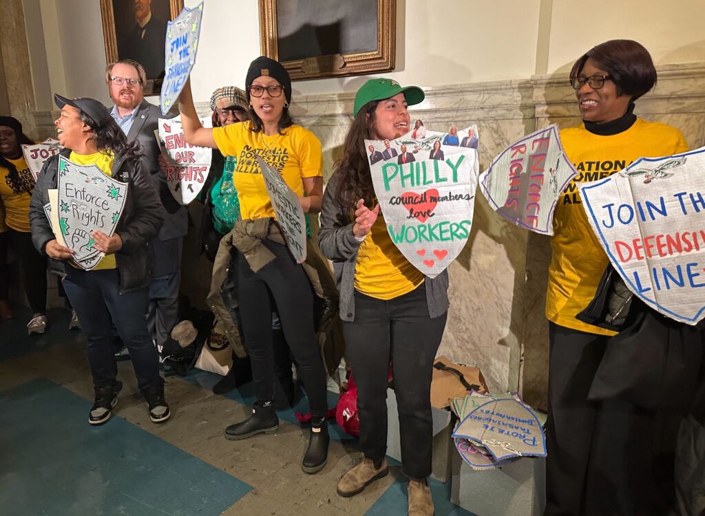 domestic-workers-philly-city-council-2025-02-06-1 people holding signs for workers rights