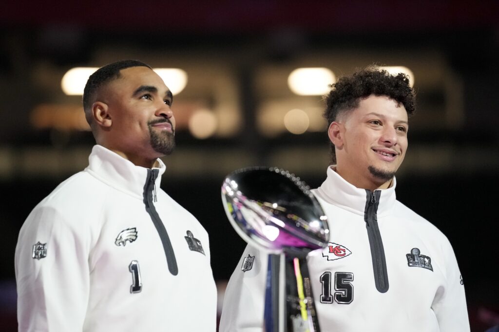 Super Bowl Football Philadelphia Eagles quarterback Jalen Hurts (1) and Kansas City Chiefs quarterback Patrick Mahomes (15) pose with the Lombardy Trophy during Super Bowl 59 Opening Night, Monday, Feb. 3, 2025, in New Orleans