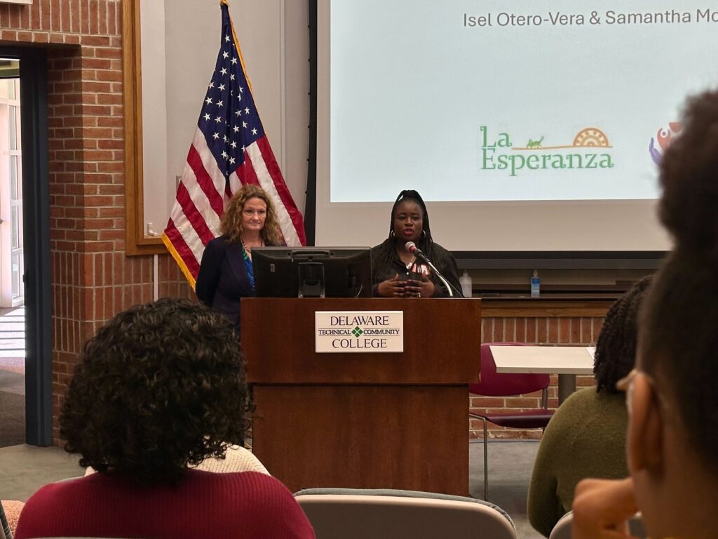 la_esparanza_latino_haitian_sussex_county_02082025 Jennifer, on the left, and Midline, on the right, from La Esperanza presents findings from the Thriving Newcomers Project at Delaware Technical Community College. Their work focuses on addressing the unique challenges faced by Latino and Haitian communities in Sussex County. (Johnny Perez-González/WHYY)