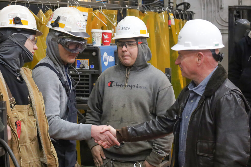 mark-kelly-crs-2025-02-18-01 Mark Kelly speaking with factory workers on the tour