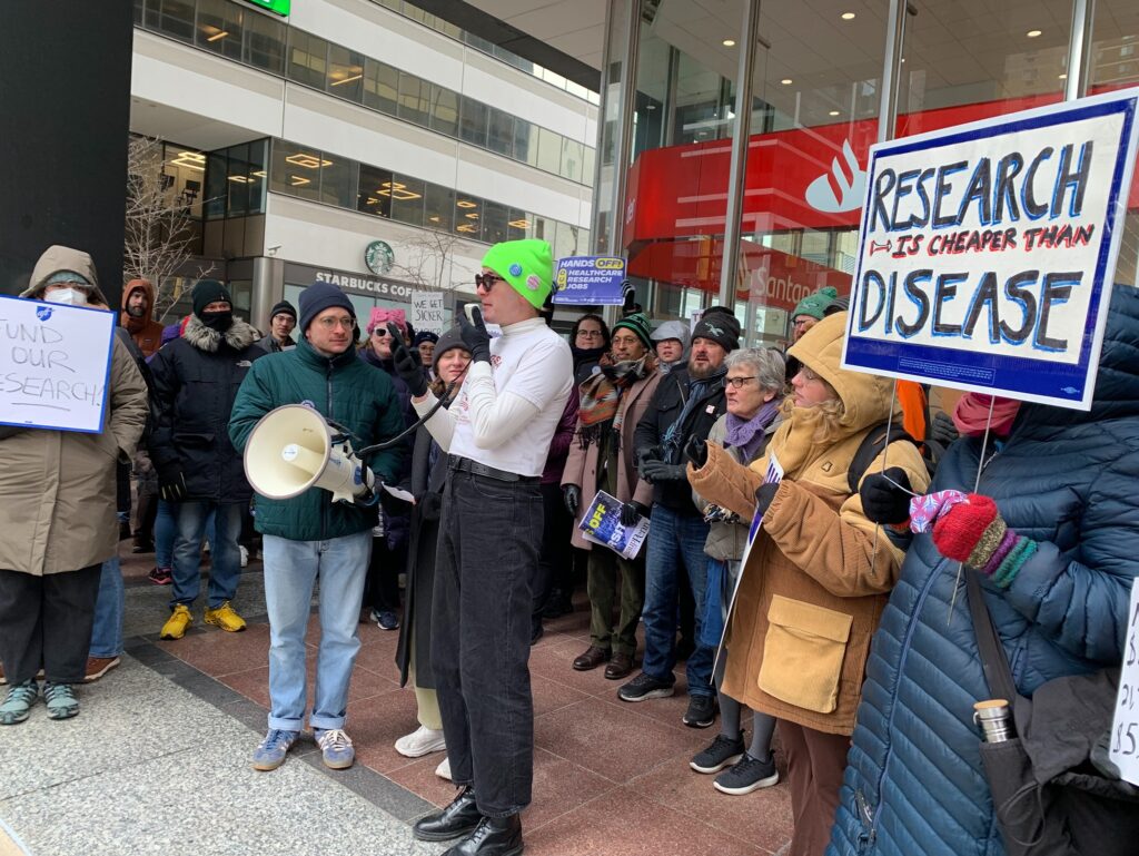 philadelphia-science-protest-2025-02-19-4 people protesting with a sign reading RESEARCH IS CHEAPER THAN DISEASE