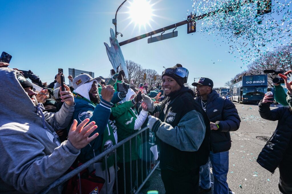 Saquon Barkley greets fans on South Broad Street during the Philadelphia Eagles Super Bowl LIX victory parade