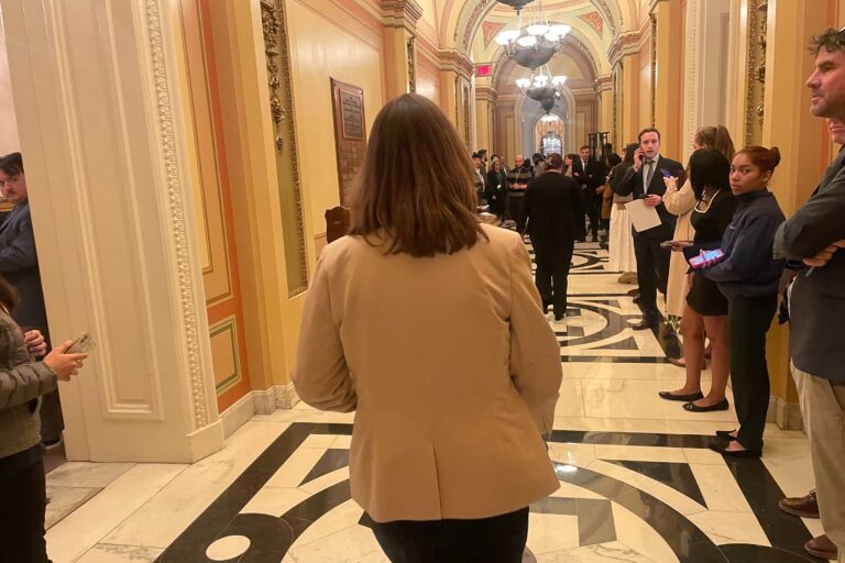 McBride walking by reporters