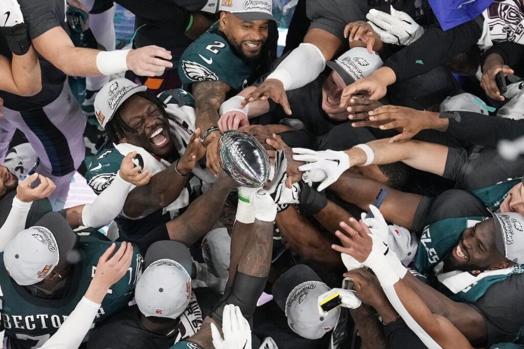 APTOPIX Super Bowl Football Philadelphia Eagles players celebrate with the Vince Lombardi Trophy after the Eagles won the NFL Super Bowl 59 football game against the Kansas City Chiefs, Sunday, Feb. 9, 2025, in New Orleans.