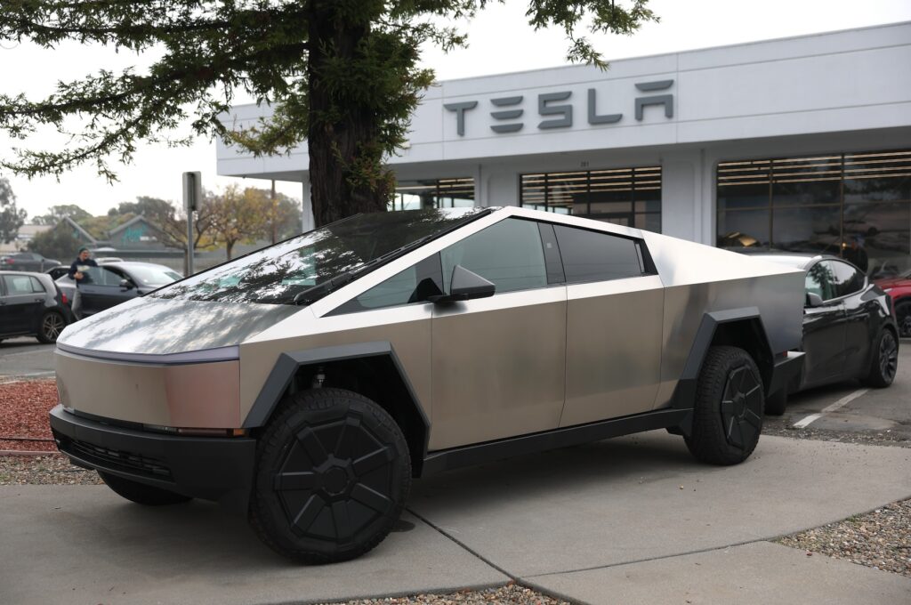 Tesla Recalls Almost 700,000 Vehicles Over Tire Pressure Warning System A Tesla Cybertruck parked at a dealership