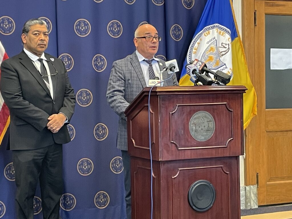 trenton-police-d-matthau-2025-02-28-1 Reed Gusciora speaking at a podium