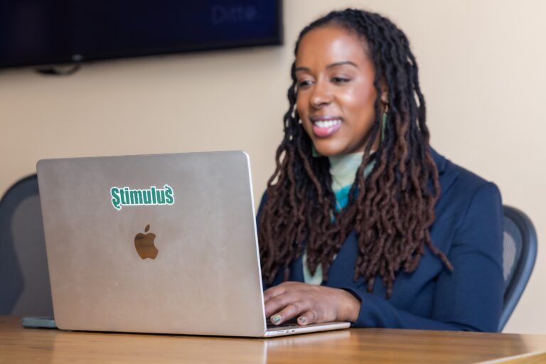 Tiffanie Stanard smiles at her computer