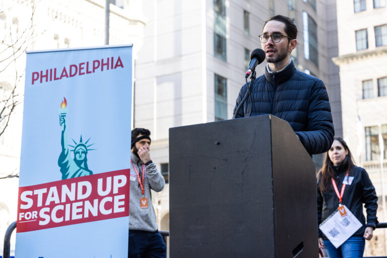 Dr. Kurt Koehler speaking at a podium