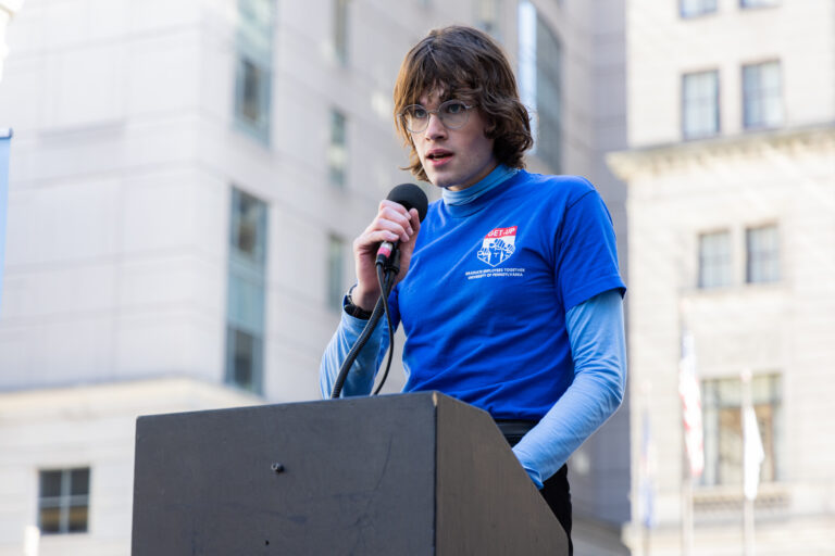Sam Layding speaking at a podium