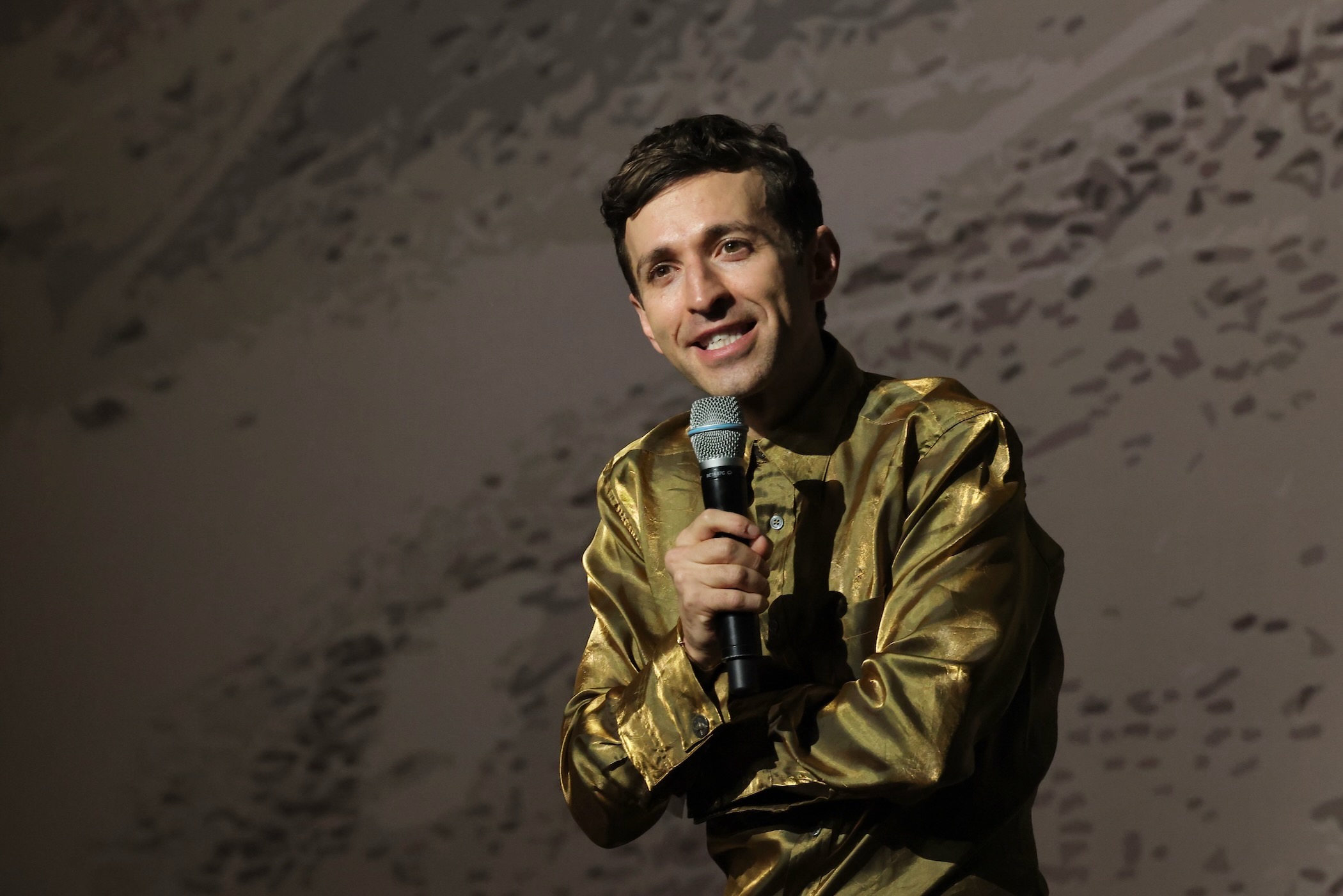 Anthony Roth Costanzo speaks into a microphone
