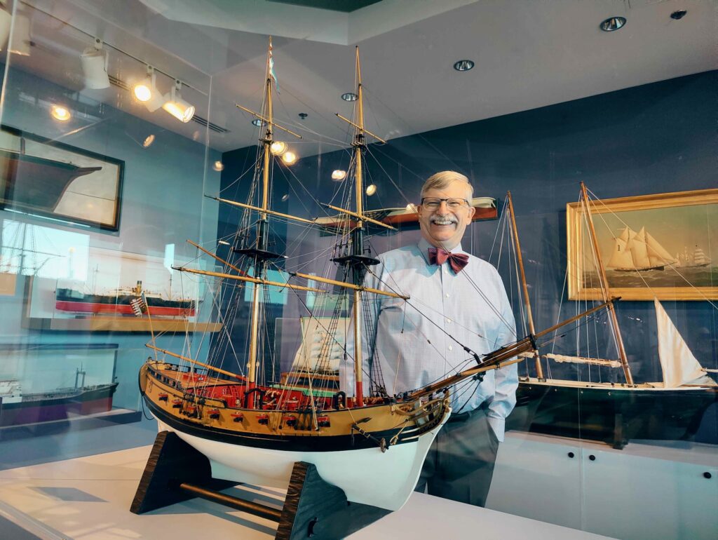 2025 03 20-p crimmins-peter siebert-philadelphia independence seaport museum-small but mighty models toys and miniature ships Peter Siebert, president and CEO of Independence Seaport Museum, stands among model ships