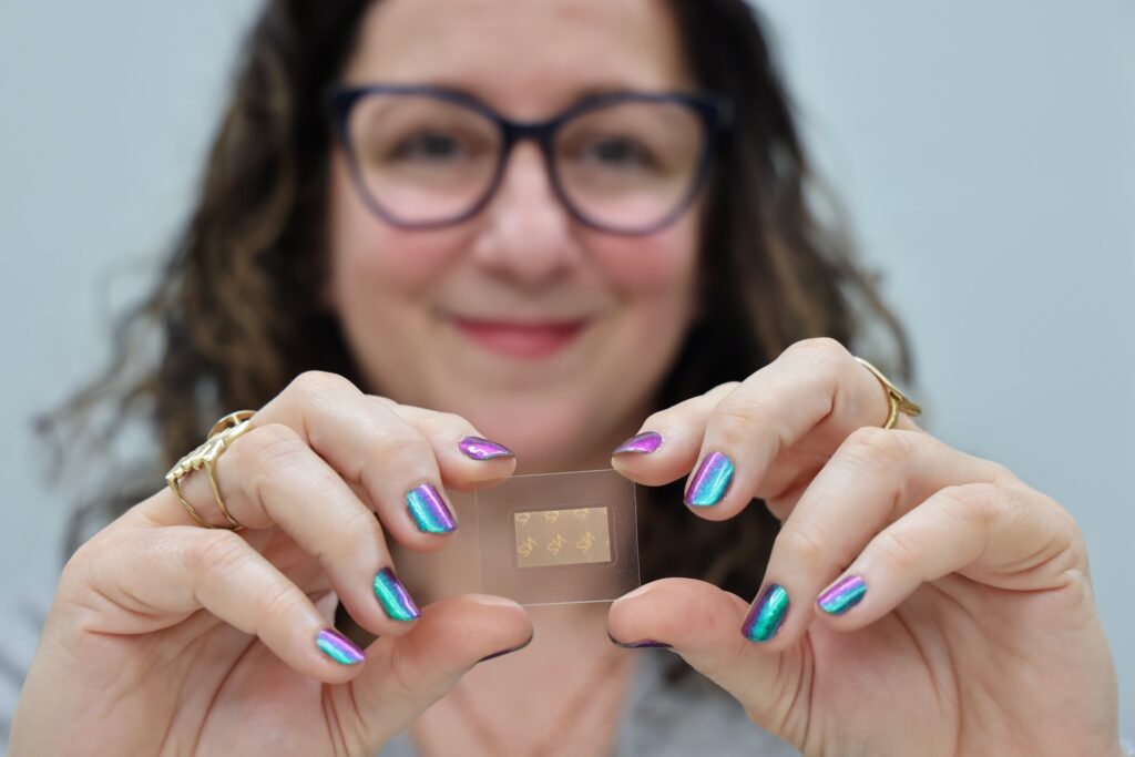 2025 -3 20-e lee-denise botcheos-philadelphia prevention point-medications for opioid use disorder suboxone film Denise Botcheos holds up a Suboxone film