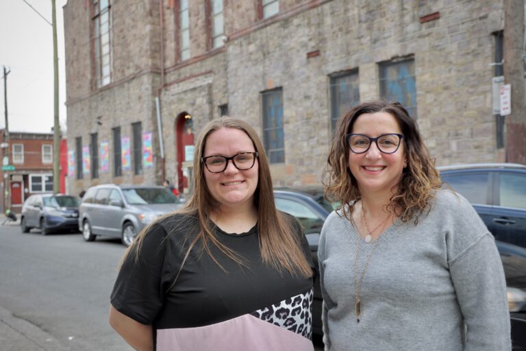 Denise Botcheos and Nicole Adams smile