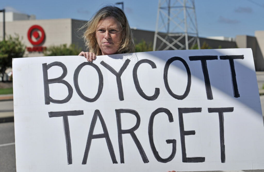 Corporate Donations Backlash Laura Hedlund, 48 of Eagan, protests in front of a Target store. (AP Photo/Craig Lassig)
