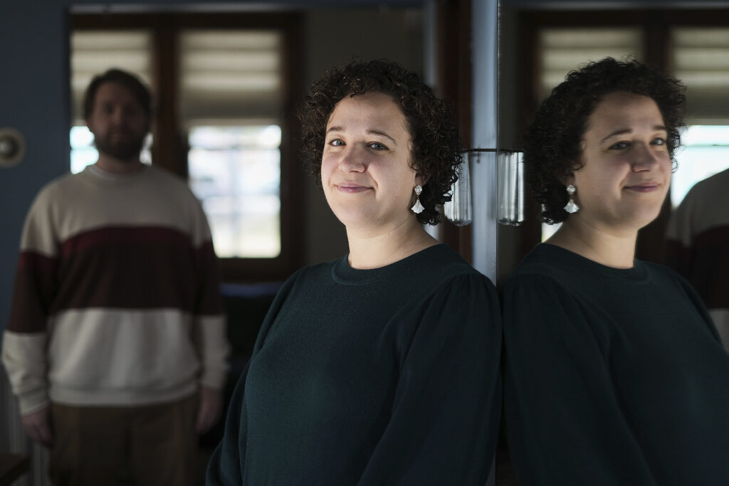 Worker Paid Leave-Growth Hannah Jones, accompanied by her spouse, Steve Cook, pose for a portrait at home near Philadelphia