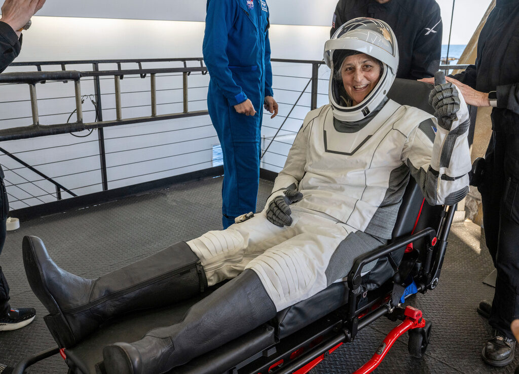 SpaceX Stuck Astronauts NASA astronaut Suni Williams gives a thumbs-up after being helped out of a SpaceX capsule