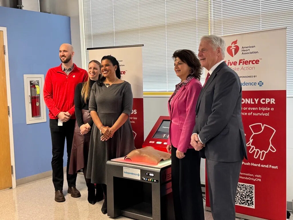 Spanish-speaking-CPR-training-philadelphia Brenda Robles-Cooke (middle left) poses with other officials next to the new Spanish-speaking CPR training device