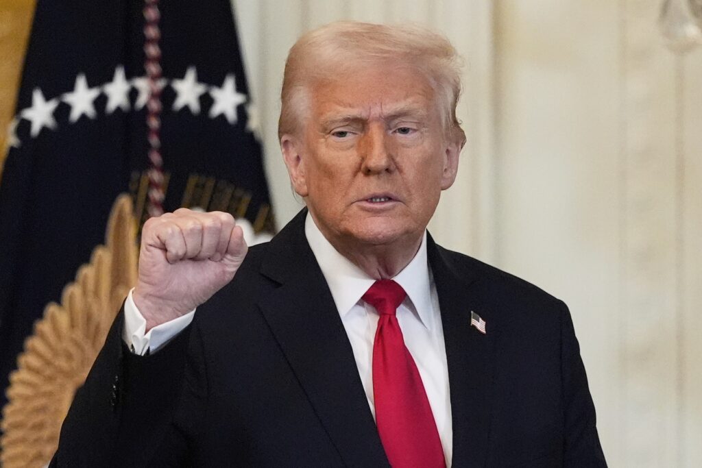 Trump Trump raising his first at a press conference