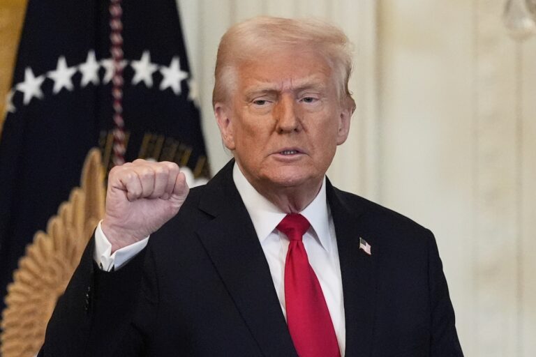 Trump raising his first at a press conference