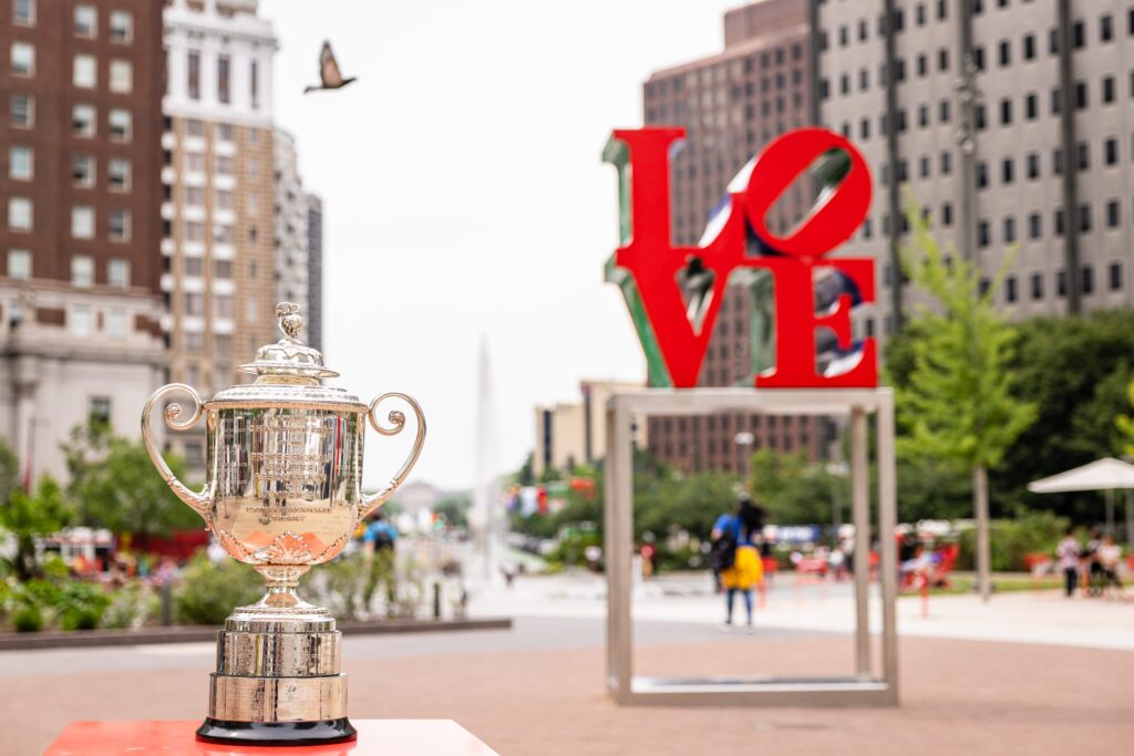 A trophy on theground in front of the LOVE sculpture at LOVE Park