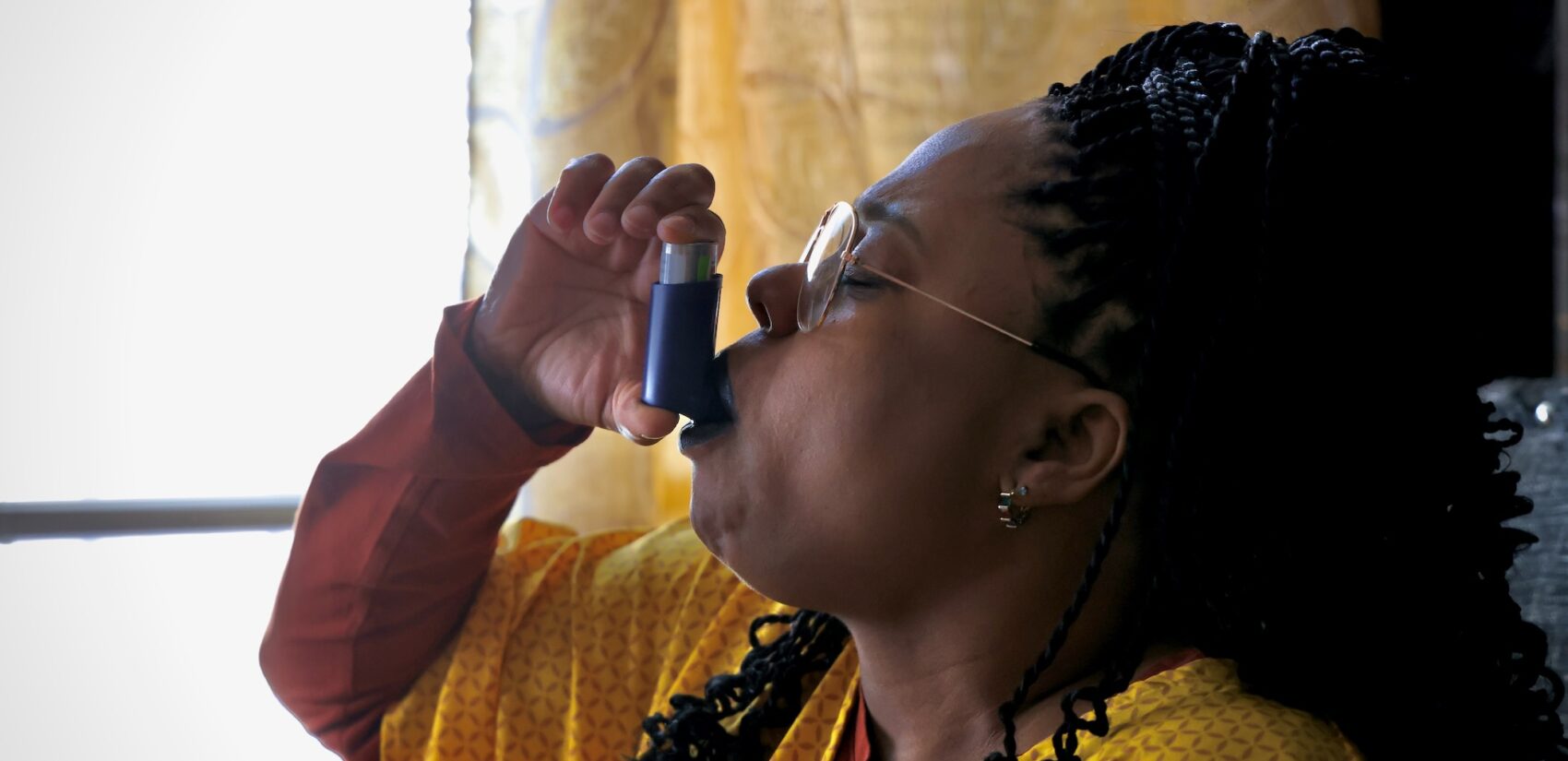 Aliyia Jones uses an inhaler