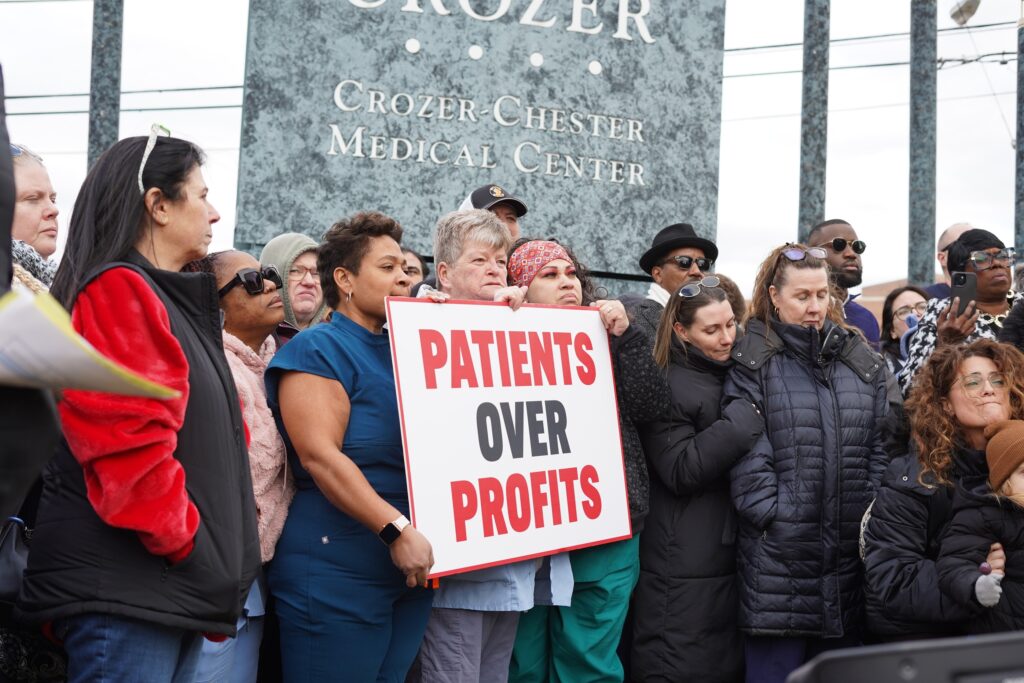 crozer-health-protest-2025-03-06-4 Crozer Health staff protesting with a sign reading PATIENTS OVER PROFITS