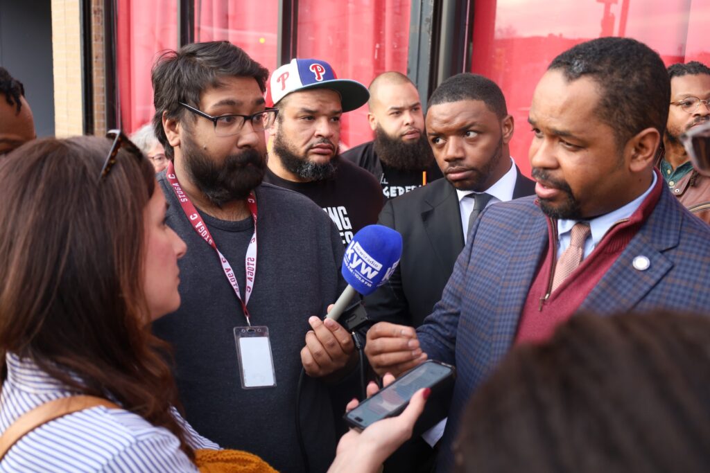 Sharif Street and Andre Carroll speaking with reporters