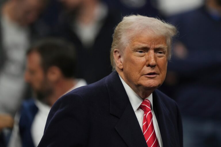 Donald Trump looks on