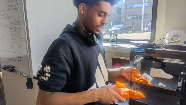 A Drexel student demonstrates how 3D printing can be used to make shoes