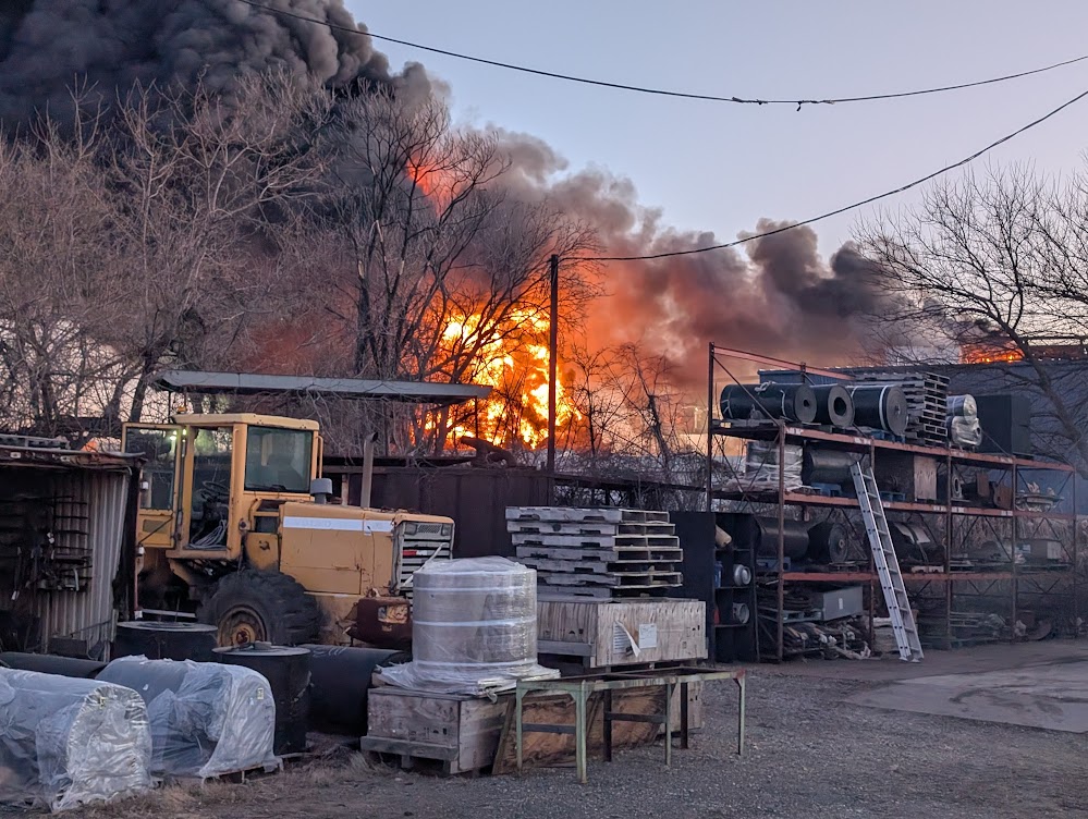 emr-fire-camden-scrapyard a fire burning at a scrapyard