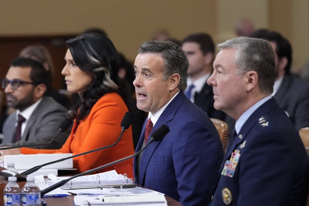 Intelligence Officials Intelligence officials sitting at a table during the hearing
