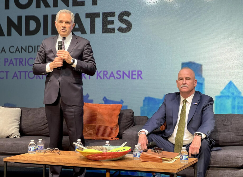 District Attorney Larry Krasner, left, and retired Municipal Court judge Patrick Dugan took part in a DA election forum.