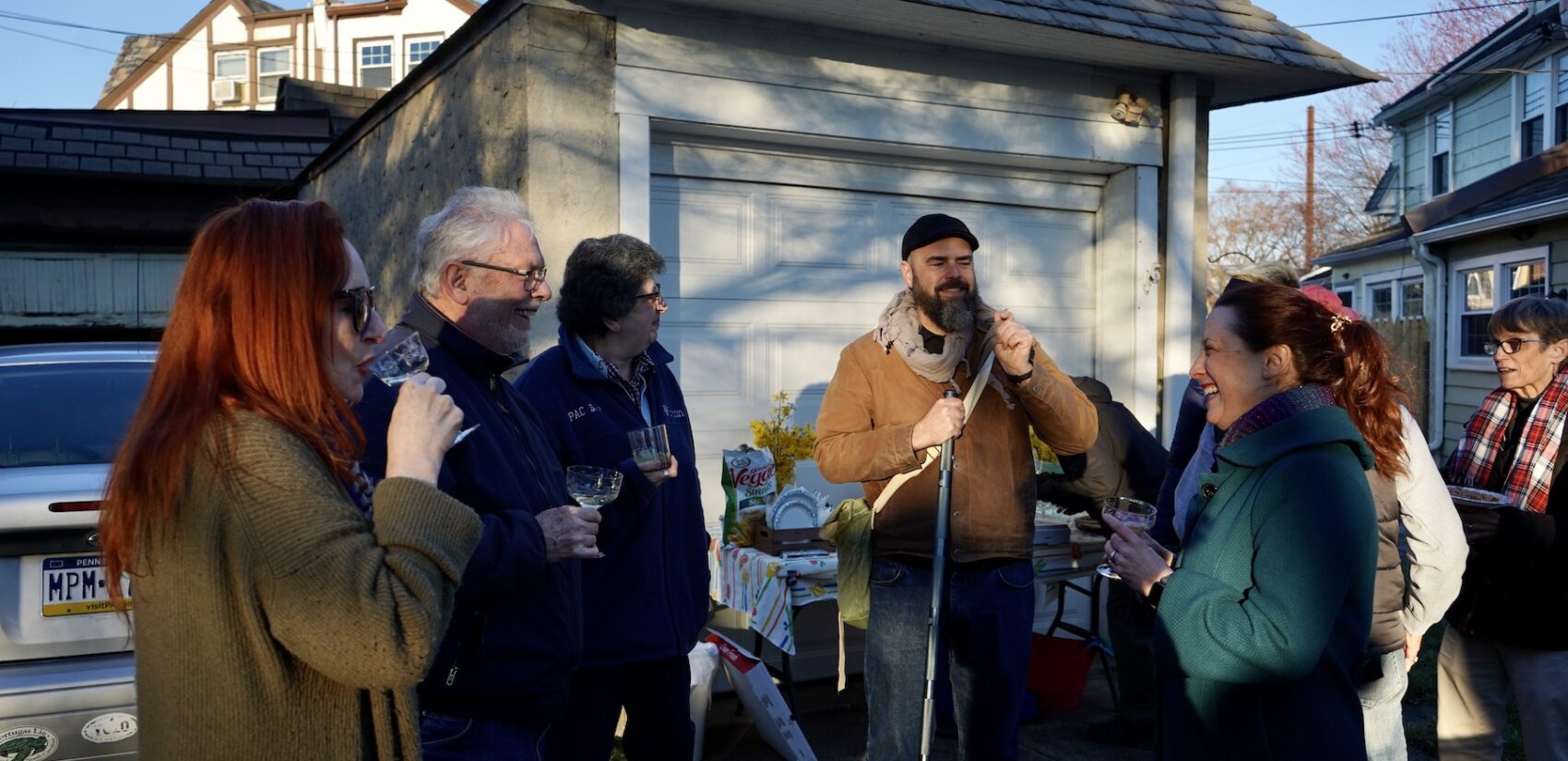 Neighbors gather in Barbara Silzle's driveway