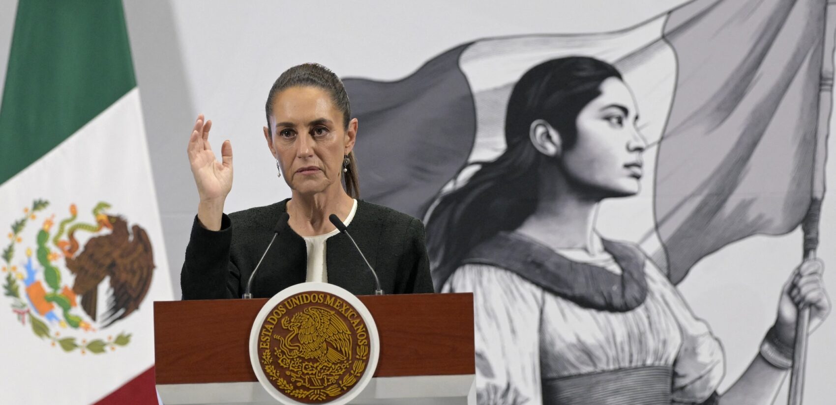Claudia Sheinbaum speaking at a podium
