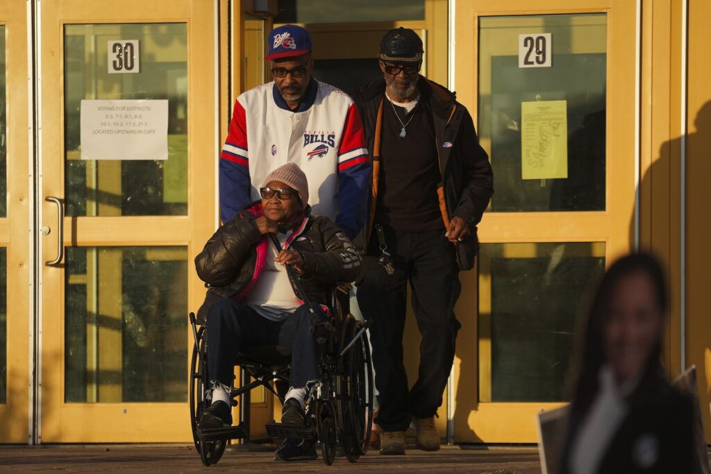 Election 2024 America Votes Pennsylvania Liza Fortt, 74 (center), accompanied by her son Timothy Walker (center top), and husband Willie Fortt emerge from their polling place at Scranton High School on Election Day, Nov. 5, 2024.
