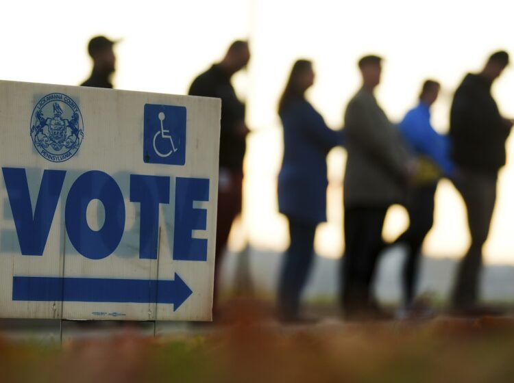 Voters wait in line to cast their ballots at Scranton High School on Election Day, Nov. 5, 2024.