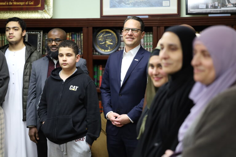 Josh Shapiro standing with a group of people at the celebration