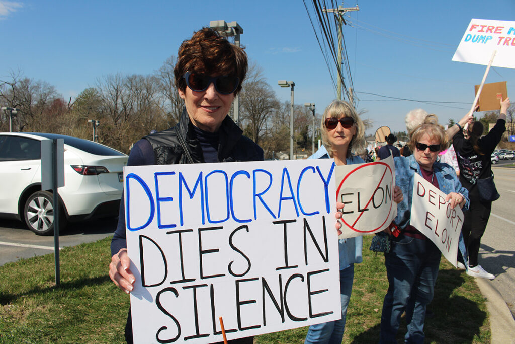 tesla-protest-6 People protest a Tesla car dealership in Chester County