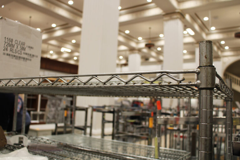 Inside the Center City Macy's, racks and shelves can be seen