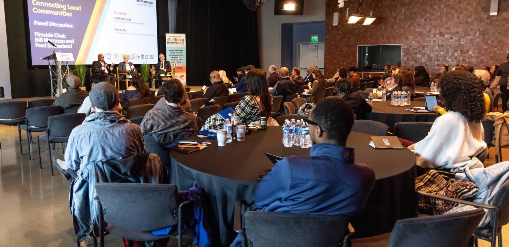 A view of the panel discussion from the back of the room