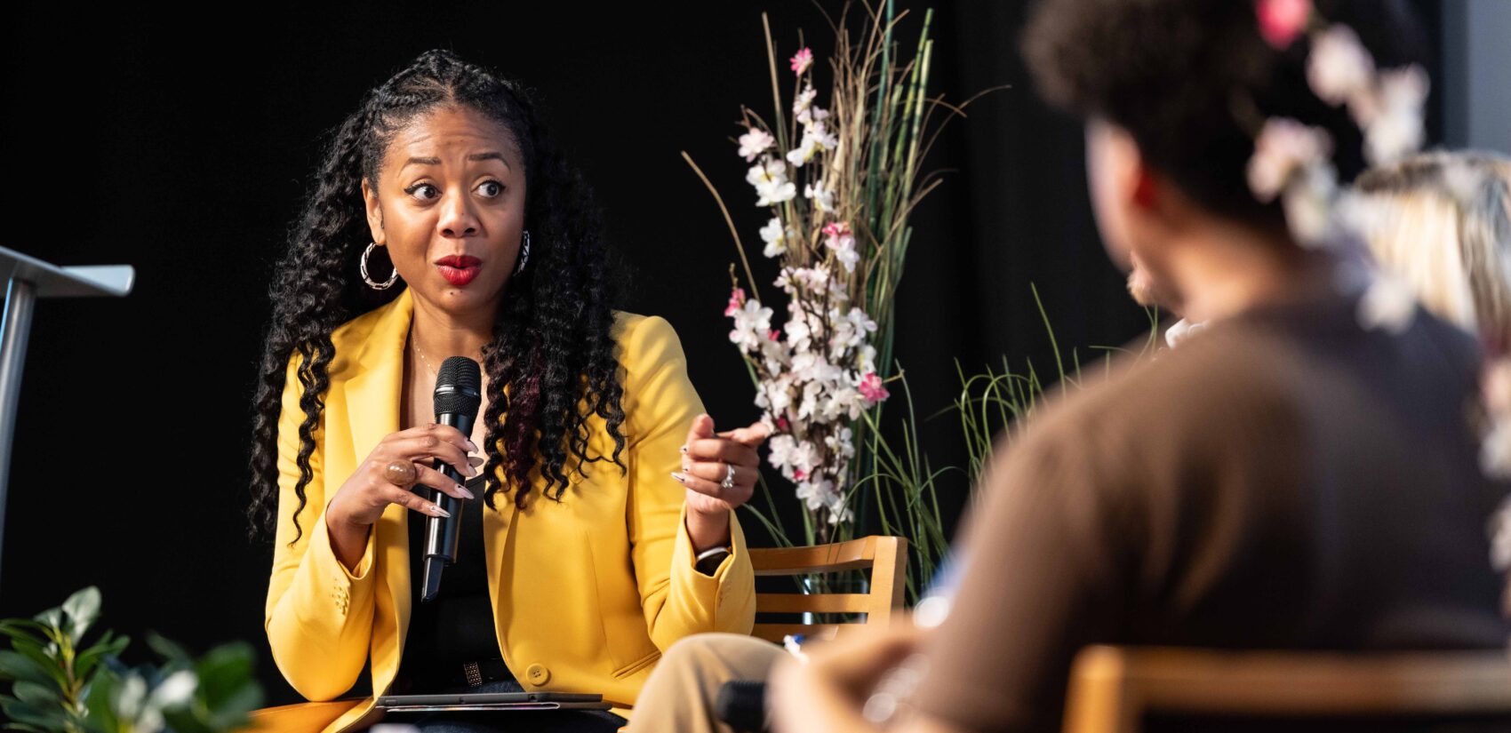 Cherri Gregg asks the panelists a question