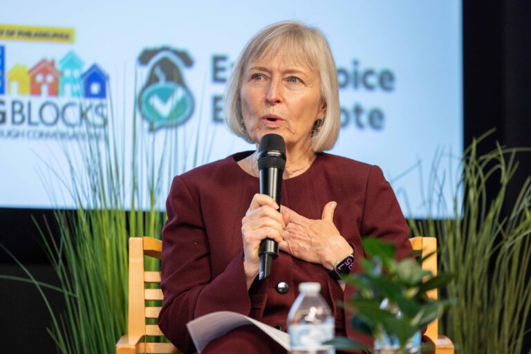 Frances Sheehan speaking on stage during a panel discussion