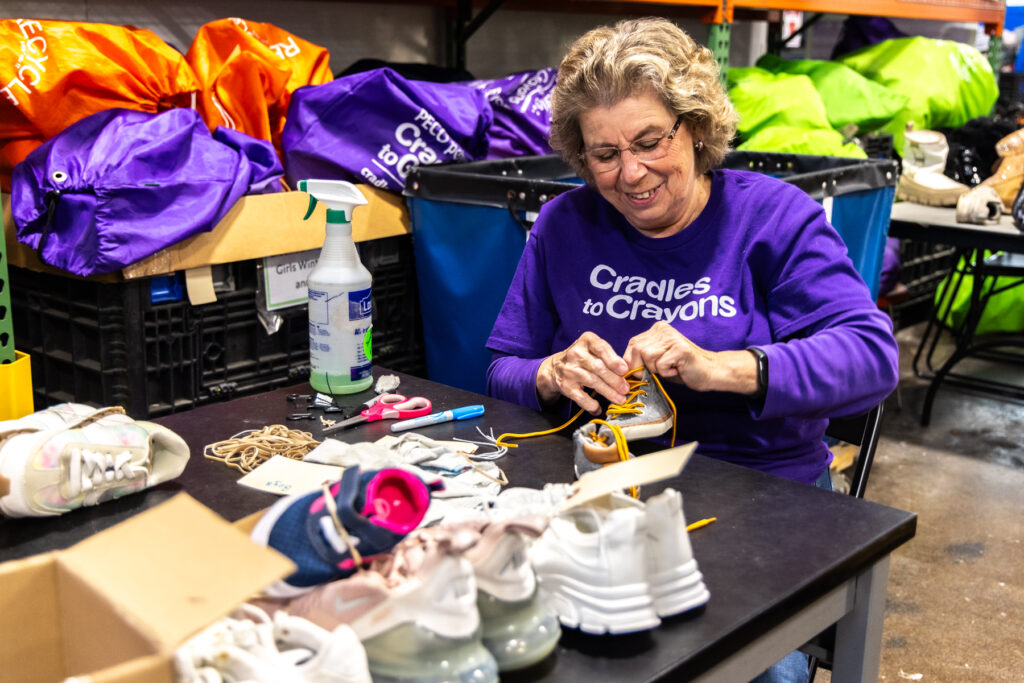 04-15-2025-k-paynter-cradles-to-crayons-philadelphia-7 Joan Craver cleans shoes