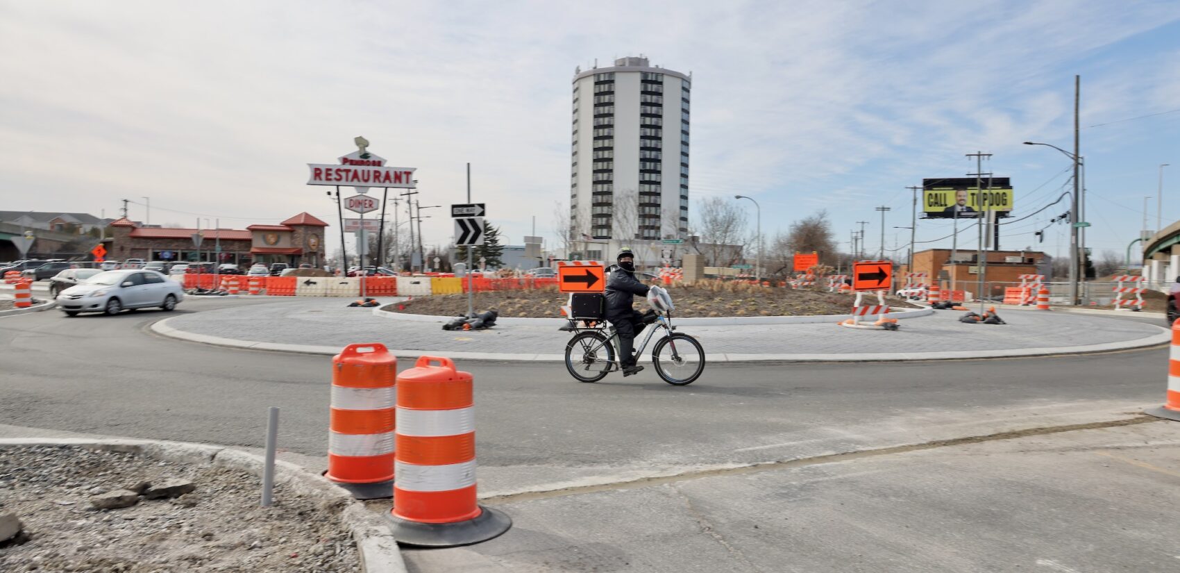 A cyclist breezes through the Penrose Roundabout