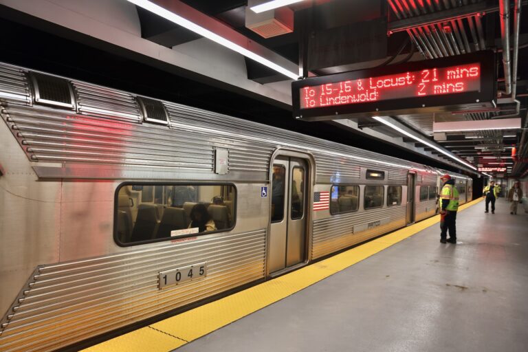A train pulls up to the platform