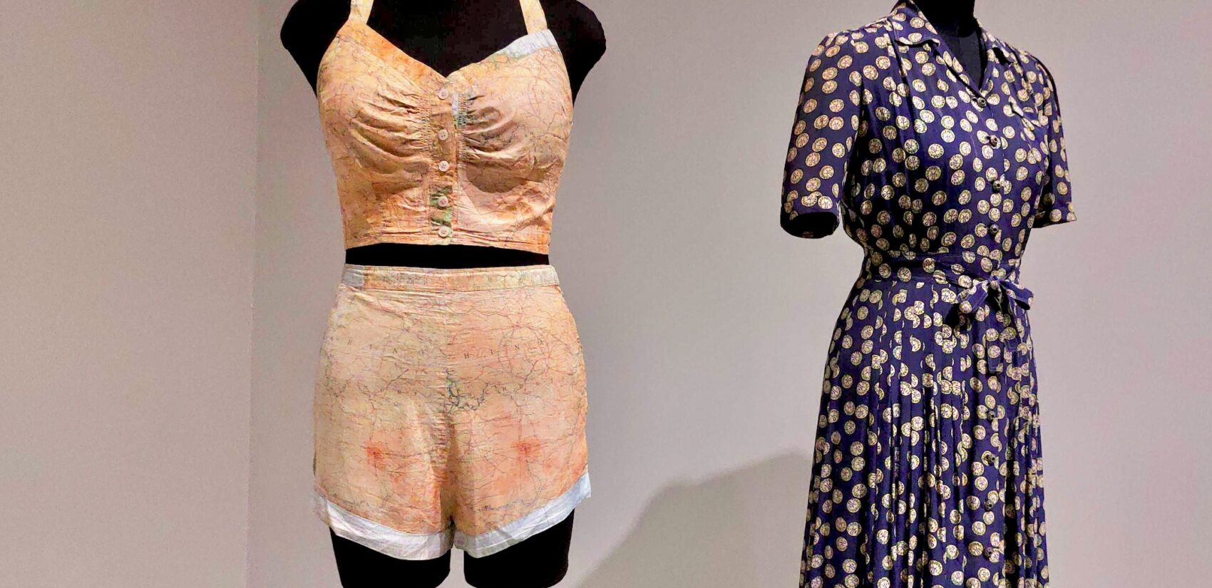 a swimsuit and a dress on mannequins