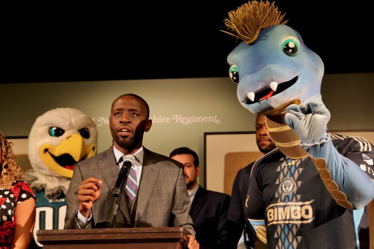 Philadelphia Union mascot, Phang, (right) mimics City Councilmember Isaiah Thomas during a press conference