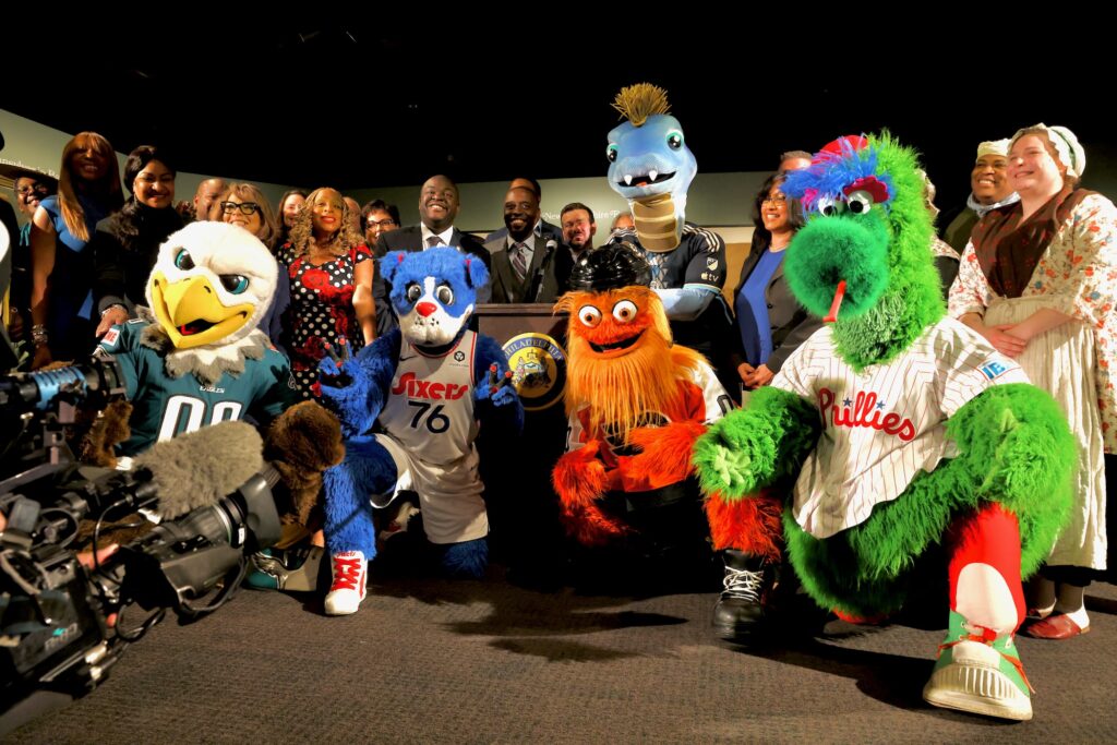 Philadelphia's major league mascots join historical figures and city officials to kick off a public hearing on preparedness for 2026 celebrations at the Museum of the American Revolution.