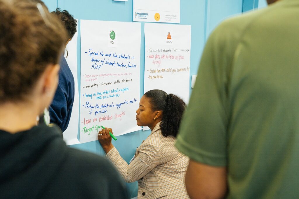 Staff member works on a brainstorming activity