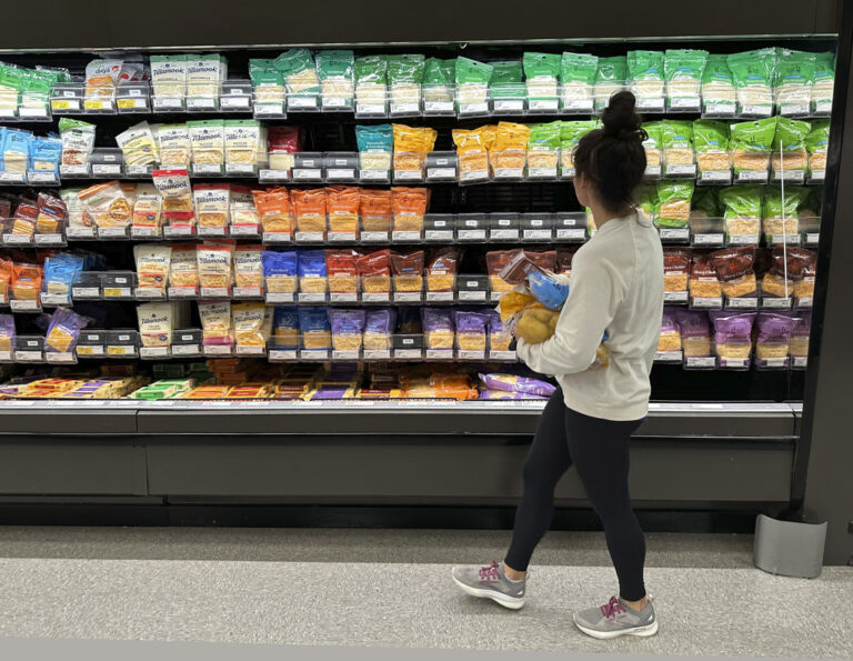 A shopper peruses cheese offerings at a Target store in Sheridan, Colo. (AP Photo/David Zalubowski, File)